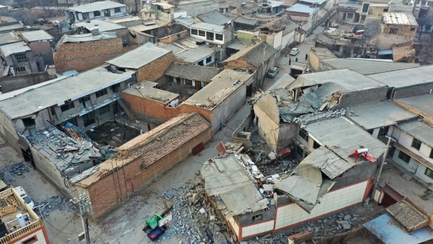 Damaged buildings in Jishishan, northwest Gansu province, on Dec. 19. Photographer: STR/AFP/Getty Images