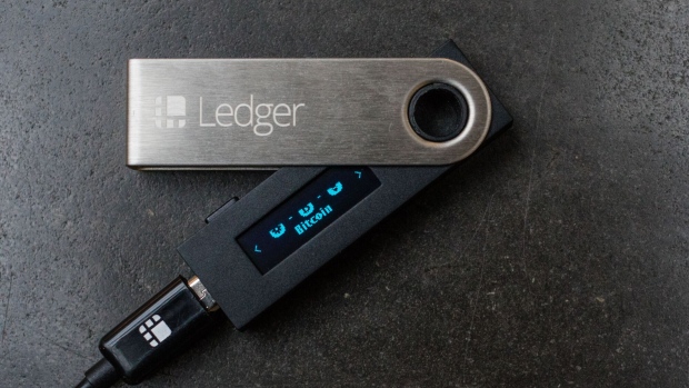 A connected Ledger SAS USB dongle used for storing and carrying around cryptocurrency passwords.