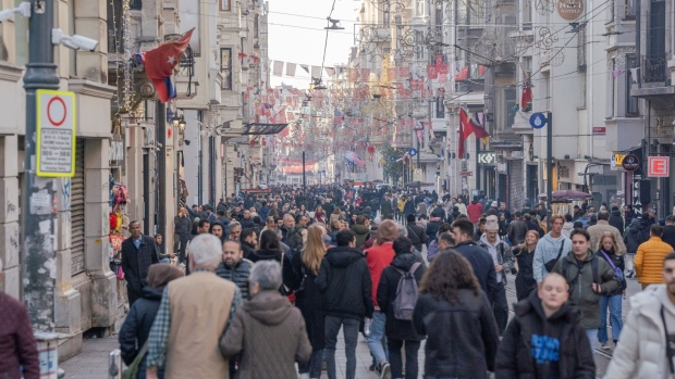 Shoppers walk along Istiklal Street in the Beyoglu district of Istanbul, Turkey, on Tuesday, Dec. 19, 2023. Turkey's central bank will hold its next interest rate decision on Dec. 21.