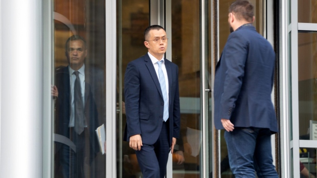 Changpeng Zhao, former chief executive officer of Binance Holdings Ltd., center, exits federal court in Seattle in November.