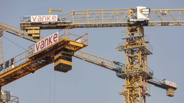 Cranes at the site of China Vanke Co.'s Isle Maison development in Hefei, China, on Monday, Nov. 27, 2023. China is ramping up pressure on banks to support struggling real estate developers, signaling President Xi Jinping’s tolerance for property sector pain is nearing its limit. Source:  /Bloomberg