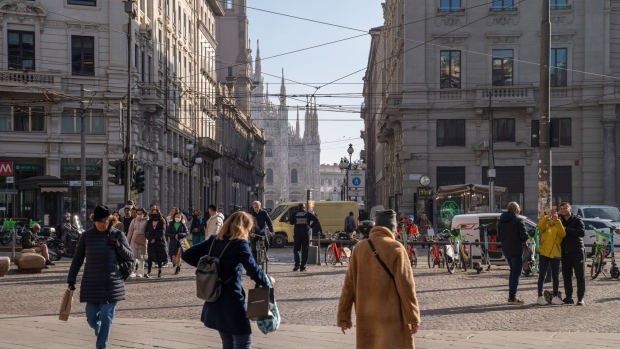 Pedestrians in Piazza Cordusio in Milan, Italy, on Wednesday Nov. 15, 2023. A possible downgrade of Italy to junk this week would be hugely symbolic, potentially consequential — and very controversial.