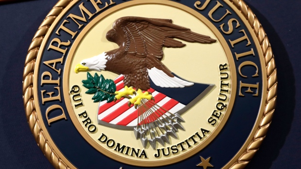 The US Department of Justice seal. Photographer: Yuri Gripas/Bloomberg