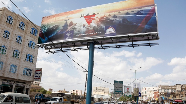 A billboard depicting navy military vessels of foreign countries including US and UK, reading ‘Navy coalition will be defeated’ in Sana’a, Yemen, on Dec. 31.