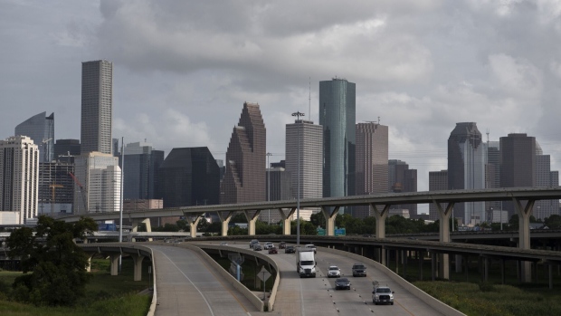 Traffic moves past the skyline of Houston, Texas, U.S., on Saturday, June 27, 2020. On Friday, the top official in Harris County, which includes Houston, declared an emergency as the Covid-19 outbreak intensifies. Photographer: Callaghan O'Hare/Bloomberg