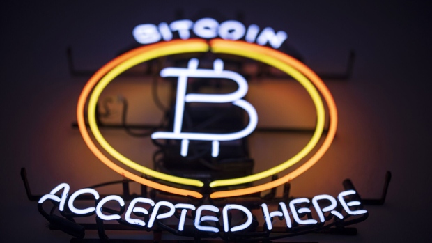 A neon sign indicates that Bitcoin is accepted inside the venue of the Paralelni Polis project, an organization combining art, social sciences and modern technology, in Prague, Czech Republic, on Friday, Jan. 5, 2024. Bitcoin has been on a tear ahead of an upcoming Jan. 10 deadline that could see the US Securities and Exchange Commission approve the first exchange-traded fund tied directly to the asset’s spot price. Photographer: Milan Jaros/Bloomberg