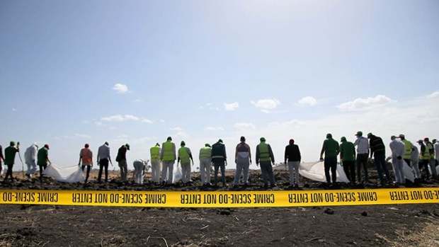 BISHOFTU, ETHIOPIA - MARCH 12: Forensics investigators and recovery teams collect personal effects and other materials from the crash site of Ethiopian Airlines Flight ET 302 on March 12, 2019 in Bishoftu, Ethiopia. All 157 passengers and crew perished after the Ethiopian Airlines Boeing 737 Max 8 Flight came down six minutes after taking off from Bole Airport in Addis Ababa. (Photo by Jemal Countess/Getty Images)