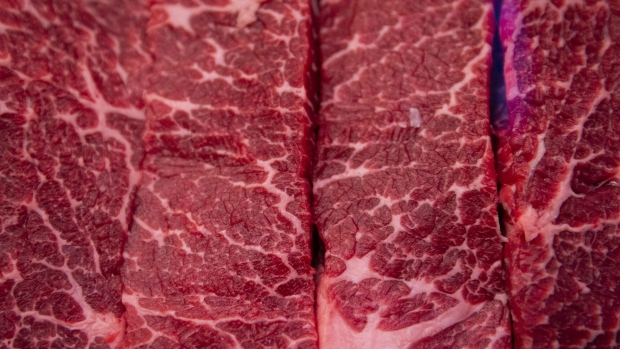 Cuts of bone-in short rib for sale at a butcher shop in the Union Market district in Washington, D.C., US, on Tuesday, Aug. 30, 2022. Food prices in July climbed 10.9% from a year earlier, according to the US Department of Labor, with the cost of food away from home such as restaurant meals advancing but at a slower pace than groceries. Photographer: Al Drago/Bloomberg