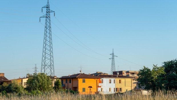 Electricity transmission towers near residential areas in Brescia, Italy. Photographer: Francesca Volpi/Bloomberg