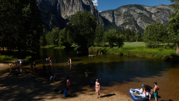 Tourists on the Merced River in Yosemite National Park, California, in 2022. The US travel industry is severely lagging its top 17 competitors, according to a study released on Jan. 11 by Euromonitor International. 
