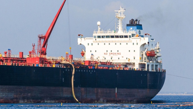 A tanker discharges crude oil via a single-point mooring (SPM) buoy during a ceremony to mark the first delivery of crude oil to the Dangote Industries Ltd. refinery in the Ibeju Lekki district of Lagos, Nigeria, on Saturday, Dec. 9, 2023. When fully operational, the refinery will be Africa’s largest by far and could transform crude and fuel markets regionally as well as internationally.