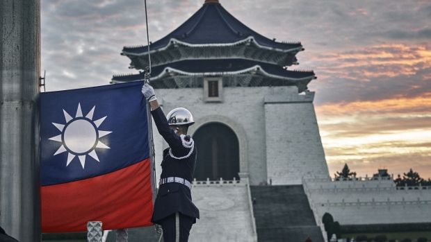 An honor guard during a flag raising ceremony at Chiang Kai Shek Memorial Hall in Taipei, Taiwan, on Wednesday, Dec. 27, 2023. Next month Taiwan holds presidential and legislature elections that will help shape US-China relations for years to come. Photographer: An Rong Xu/Bloomberg
