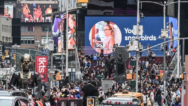 Pedestrians and shoppers in the Times Square neighborhood of New York, US, on Friday, Oct. 27, 2023. The US economy grew at the fastest pace in nearly two years last quarter on a burst of consumer spending, which will be tested in coming months.