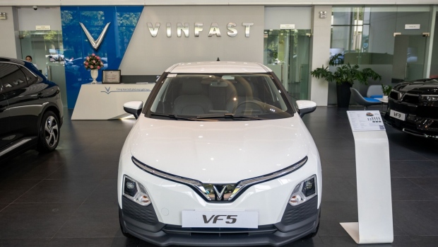 VinFast Auto Ltd. electric vehicle VF5 model on display at the company's showroom in Hanoi, Vietnam, on Thursday, Sept. 7, 2023. VinFast is one of Vietnam’s most high-profile companies, backed by the country’s wealthiest man Pham Nhat Vuong — who has established Vingroup JSC, a conglomerate spanning homes, hotels, hospitals and shopping malls. The group, together with its affiliates and lenders, have deployed $8.2 billion to fund VinFast’s operating expenses and capital expenditures the last six years.