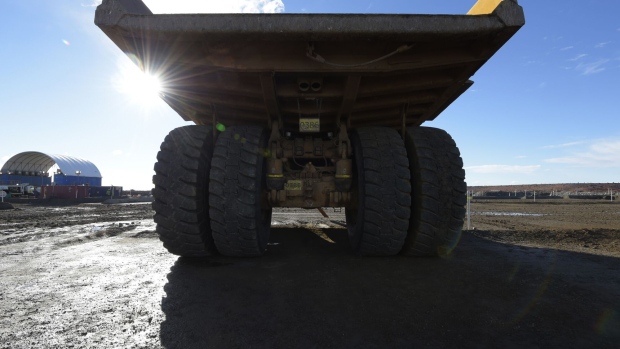 A dump truck sits parked in a workshop area of the St Ives Gold Mine operated by Gold Fields Ltd. in Kambalda, Australia, on Wednesday, Aug. 9, 2017. Global gold deals have also slowed, declining to $19.8 billion in 2016 from $22.8 billion a year earlier, according to data complied by Bloomberg. Photographer: Carla Gottgens/Bloomberg