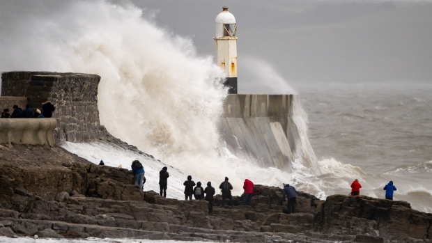 Waves crash against the harbor wall in Porthcawl, Wales, on Jan. 21, 2024. Photographer: Matthew Horwood/Getty Images