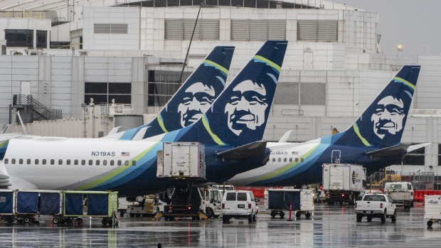 An Alaska Airlines Boeing 737-900ER aircraft on the tarmac at Seattle-Tacoma International Airport (SEA) in Seattle, Washington, US, on Monday, Jan. 22, 2024. The FAA recommended that airlines inspect Boeing 737-900ER models that use mid-aft plugs of the same type that failed on an Alaska Airlines flight this month.