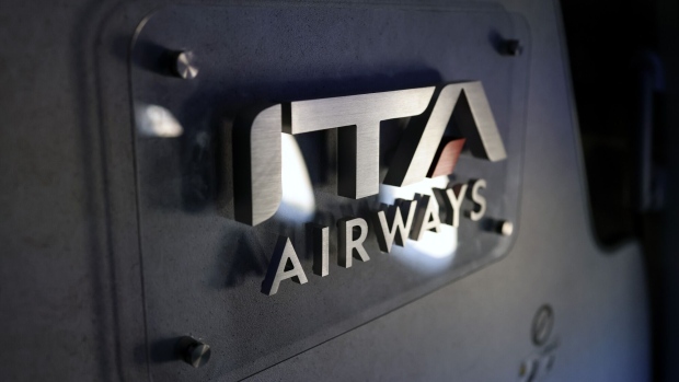 An ITA Airways logo inside a new Airbus A320neo passenger aircraft, operated by ITA Airways, at Fiumicino airport in Rome, Italy, on Wednesday, April 19, 2023. Italy state-owned carrier ITA Airways approved a business plan shared with Deutsche Lufthansa AG, a further step toward selling a minority stake to the German airline. Photographer: Alessia Pierdomenico/Bloomberg