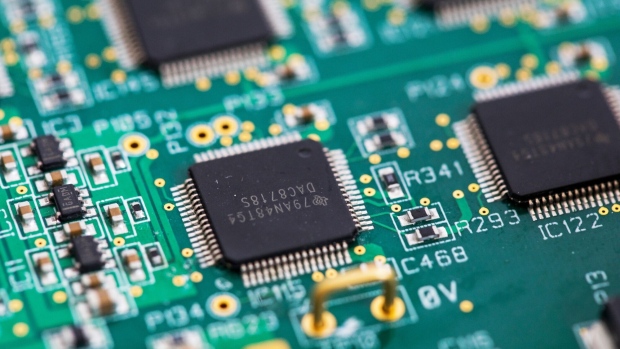 A Texas Instruments Inc. integrated circuit microchip on a circuit board.