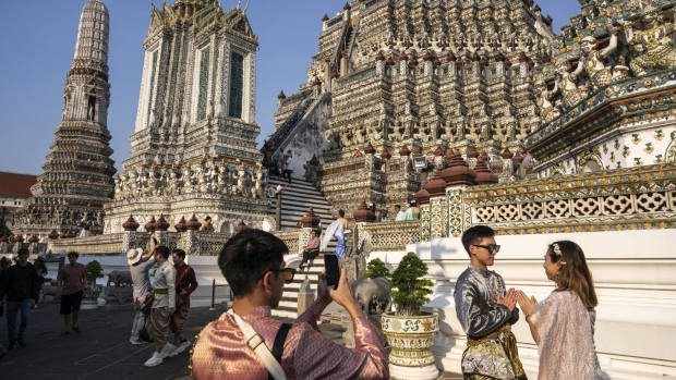 Tourists at Wat Arun in Bangkok.