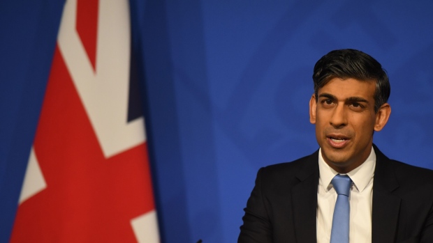 Rishi Sunak, UK prime minister, speaks during a news conference at Downing Street in London, UK, on Thursday, Jan. 18, 2024. The House of Commons voted 320 to 276 on Wednesday in favor of Sunak’s plan to send migrants to Rwanda, after most Conservative Party rebels who had tried to force the government to toughen the bill fell into line rather than risk triggering political turmoil.