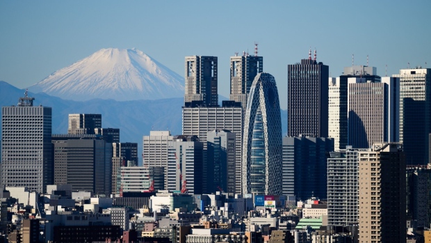 Mount Fuji and the Shinjuku skyline seen from an observation deck in Tokyo, Japan, on Tuesday, Dec. 26, 2023. Japan’s industrial output in November is scheduled to be released by the Ministry of Economy, Trade and Industry on Dec. 28. Photographer: Akio Kon/Bloomberg