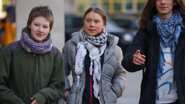 Greta Thunberg, climate campaigner, center arrives at Westminster Magistrates Court in London, UK, on Thursday, Feb. 1, 2024. Thunberg was charged by London police over demonstrations around a major energy industry event on Oct. 17, where crowds of protesters had blocked several top oil executives from entering the venue. Photographer: Carlos Jasso/Bloomberg 