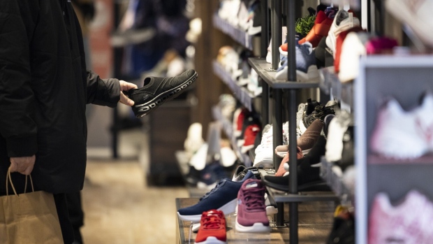 A customer shops for shoes at a Skechers' store in the SoHo neighborhood of New York, US on Wednesday, March 22, 2023. US retail sales fell in February after a surge in the prior month, suggesting consumer spending, while holding up, is getting challenged by high inflation.
