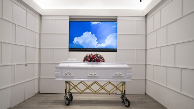 A casket is seen inside a room at Flying Home funeral services, an affiliate of Ang Chin Moh Funeral Directors Pte., in Singapore, on Thursday, Jan. 23, 2020. The business of death and dying has long been taboo across much of Asia; cemeteries and nursing homes near residential areas are shunned, while investors attract gossip. But a rising pool of wealthy Asian families and philanthropists are defying social norms, boosting investments and educational campaigns to improve and destigmatize the industry. Photographer: Wei Leng Tay/Bloomberg