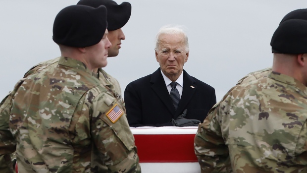 Joe Biden places his hand over his heart during a dignified transfer at Dover Air Force Base on Feb. 2.