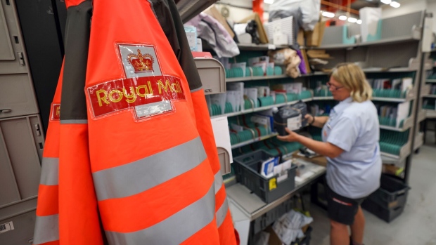 An employee sorts through post at the Royal Mail Plc sorting office in Chelmsford, U.K., on Thursday, May 13, 2021. Royal Mail are due to report earnings on Thursday, May 20.