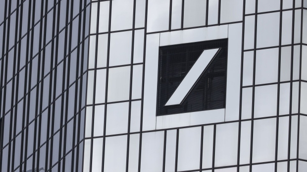 A logo on the exterior of the Deutsche Bank AG headquarters in the financial district of Frankfurt, Germany, on Thursday, Feb. 1, 2024. Deutsche Bank plans to cut 3,500 jobs over the coming years as Chief Executive Officer Christian Sewing seeks to make good on a pledge to lift profitability and return more money to shareholders. Photographer: Alex Kraus/Bloomberg