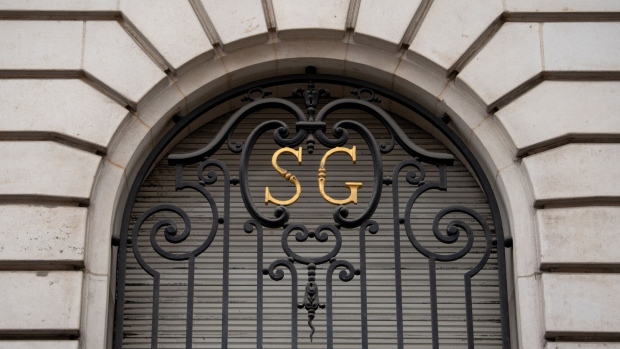 An 'SG' logo on ironwork at a Societe Generale SA office building in central Paris, France, on Monday, Feb. 5, 2024. Societe Generale plans to cut about 900 jobs at its French head office as part of Chief Executive Officer Slawomir Krupa’s plan to cut costs and strengthen capital. Photographer: Benjamin Girette/Bloomberg