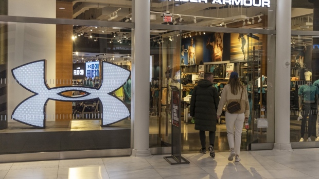Shoppers enter an Under Armour store at the Oculus Center in New York, US, on Wednesday, May 4, 2023. Under Armour Inc. is scheduled to release earnings figures on May 9.