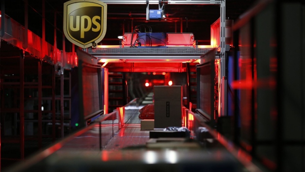 Packages move along a conveyor belt at the United Parcel Service Inc. (UPS) Chicago Area Consolidation Hub (CACH) facility in Hodgkins, Illinois, U.S., on Monday, Nov. 28, 2016. Online stores are counting on shoppers to spend big during the "Cyber Five" period from Thanksgiving to Cyber Monday to make up for time spent earlier this month obsessing about the presidential election instead.