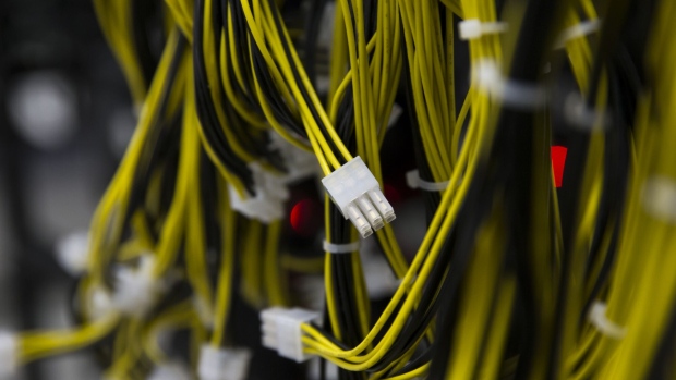Ethernet cables are seen inside the DMM Mining Farm, operated by DMM.com Co., in Kanazawa, Japan, on Tuesday, March 20, 2018. Japan is moving toward legalizing initial coin offerings, even as countries such as China and the U.S. restrict the fundraising technique because of their risks for investors. A government-backed study group laid out basic guidelines for further adoption of ICOs, according to a report published on April 5. Photographer: Tomohiro Ohsumi/Bloomberg