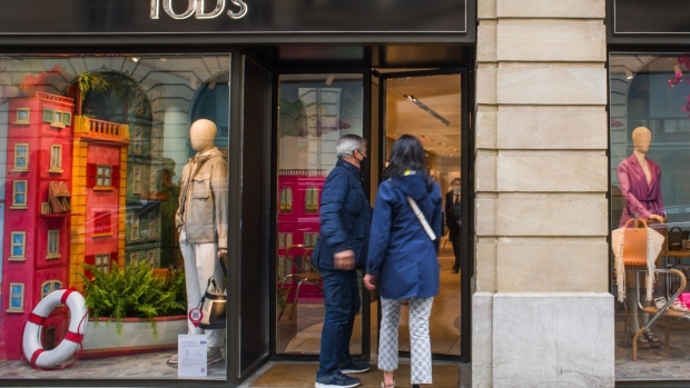 Customers enter a Tod's SpA footwear store in Paris, France, on Thursday, May 20, 2021. Shares in Tod's soared this year after the troubled Italian shoemaker hired a popular influencer, Chiara Ferragni, to its board and as luxury conglomerate LVMH boosted its stake to 10%.