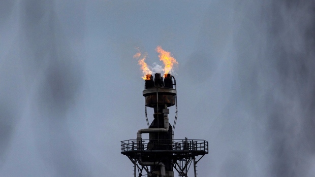 A flare stack burns at the PCK Schwedt oil refinery, formerly owned by Rosneft PJSC and now controlled by the German government, in Schwedt, Germany, on Monday, March 20, 2023. Germany's economy will probably shrink in the first quarter of the year, according to the ZEW institute's gauge of expectations, as concerns over risks in the banking sector add to headwinds from inflation, even as the rate should decline "significantly", the Bundesbank said. Photographer: Krisztian Bocsi/Bloomberg