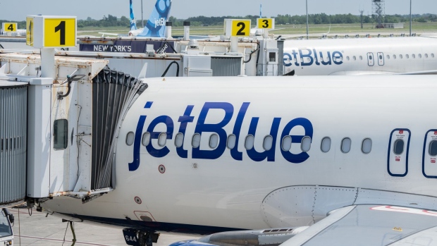 JetBlue airplanes at John F. Kennedy International Airport (JFK) in New York, US, on Sunday, July 23, 2023. JetBlue Airways Corp. is scheduled to release earnings figures on August 1. Photographer: Jeenah Moon/Bloomberg