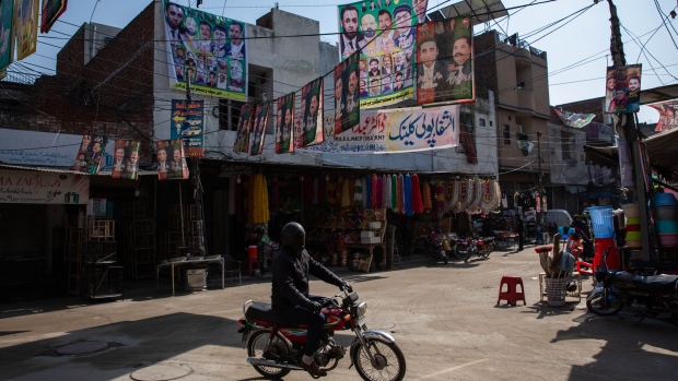 Campaign posters hang over a street ahead of Pakistan's national election in Lahore, Pakistan, on Friday, Feb. 2, 2024. Pakistan is gearing up for two key events in quick succession: a general election and the expiry of an International Monetary Fund bailout program. The election winner will be tasked with striking a new deal with the IMF, which investors say is crucial to the nation’s outlook.