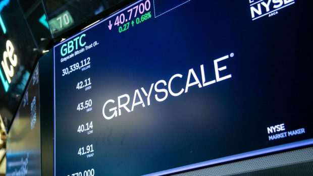 Grayscale Bitcoin Trust ETF (GBTC) signage on the floor of the New York Stock Exchange (NYSE) in New York, US, on Thursday, Jan. 11, 2024. Bitcoin surged past $49,000 for the first time since December 2021 with trading commencing on the first US exchange-traded funds that invest directly in the biggest cryptocurrency. Photographer: Michael Nagle/Bloomberg