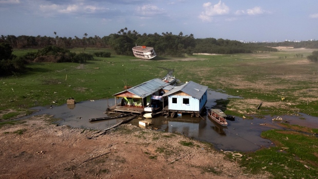 Floating houses in a drought-hit harbor of Cacau Pirêra in Iranduba, Brazil in October. 