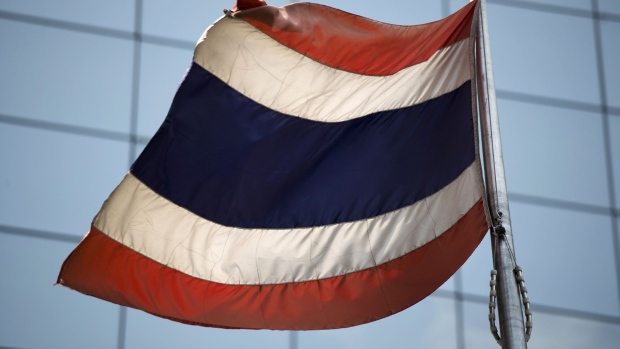 A Thai flag stands outside the Stock Exchange of Thailand (SET) in Bangkok, Thailand, on Tuesday, Feb. 12, 2019. Uncertainty surrounding the Thailand's national elections will have an impact on equities, according to Nader Naeimi, head of dynamic markets at AMP Capital Investors Ltd. Photographer: Brent Lewin/Bloomberg