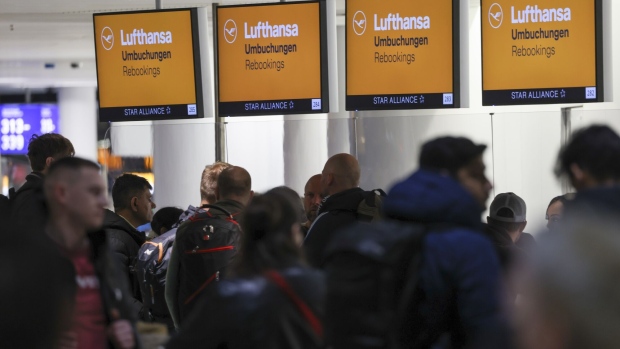 Passengers queue at the rebooking desk, during a strike by airport security workers, at Frankfurt Airport in Frankfurt, Germany, on Thursday, Feb. 1, 2024. Verdi, Germany's main services union, called security workers at major airports to stage a one-day strike this week, threatening to bring chaos to flight traffic in Frankfurt and regional hubs.