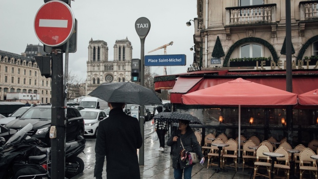 Pedestrians pass an empty restaurant terrace in Paris, France, on Monday, Jan. 2, 2023. Insee said France's inflation will continue to advance, peak in January and remain above 5% throughout the first half of the year.