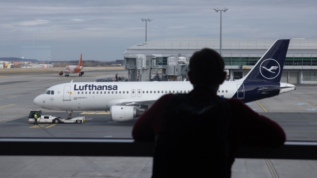 An Airbus SE A220-300 passenger jet, operated by Deutsche Lufthansa AG, at Vaclav Havel Airport in Prague, Czechia, on Wednesday, Feb. 14, 2024. With global air travel almost completely recovered from the pandemic, cutting emissions is once again the industry’s No. 1 challenge.