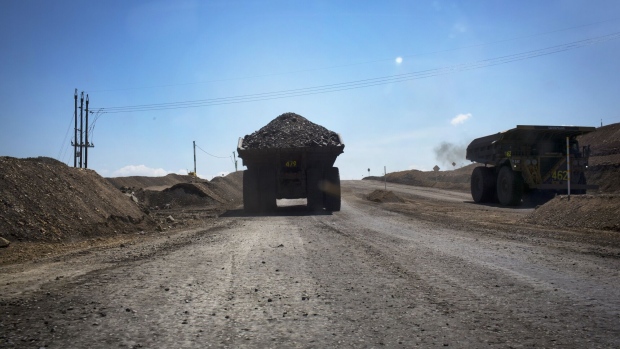 Dump trucks carry coal at a mine in Colombia.Photographer: Nicolo Filippo Rosso/Bloomberg