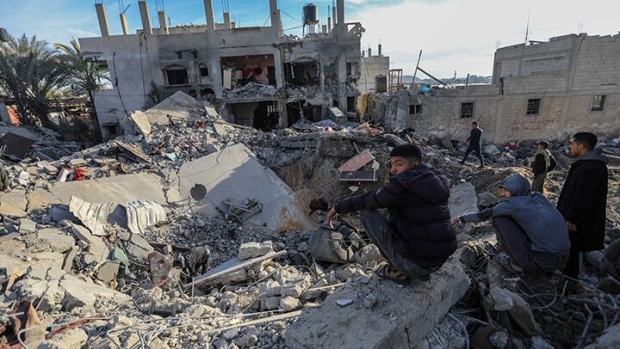 People inspect the damage to their homes following Israeli air strikes on in Rafah, on Feb. 12.