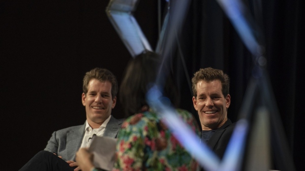 Tyler Winklevoss, chief executive officer and co-founder of Gemini Trust Co., left, and Cameron Winklevoss, president and co-founder of Gemini, right, attend the South By Southwest (SXSW) conference in Austin, Texas, U.S., on Friday, March 8, 2019. The SXSW conference provides an opportunity for global professionals at every level to participate, network, and advance their careers.