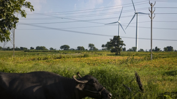 Wind turbines at the ReGen Powertech Pvt. farm in Dewas, Madhya Pradesh, India, on Friday, Sept. 9, 2022. Prime Minister Narendra Modi is pushing a 2070 net-zero goal, and his Power Minister, Raj Kumar Singh, has said the country will limit exports of credits to prioritize its own climate goals. Photographer: Aparna Jayakumar/Bloomberg